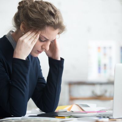 images of a young business women stressed